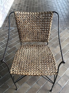 Wicker weave and black metal designer chair front s300